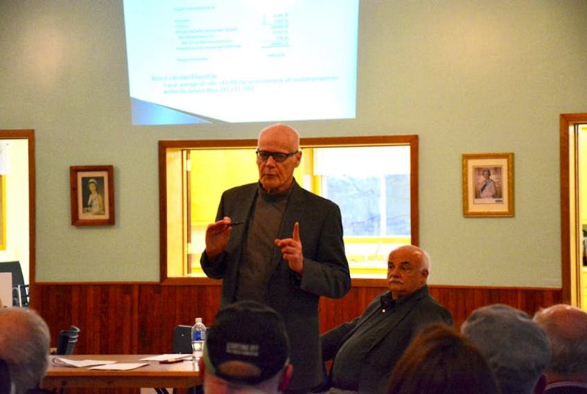 Municipality of Kings County Mayor Peter Muttart speaks to residents of East Kings about a proposed area rate for fire services. After a lengthy discussion it was decided to delay the vote to verify call volume.