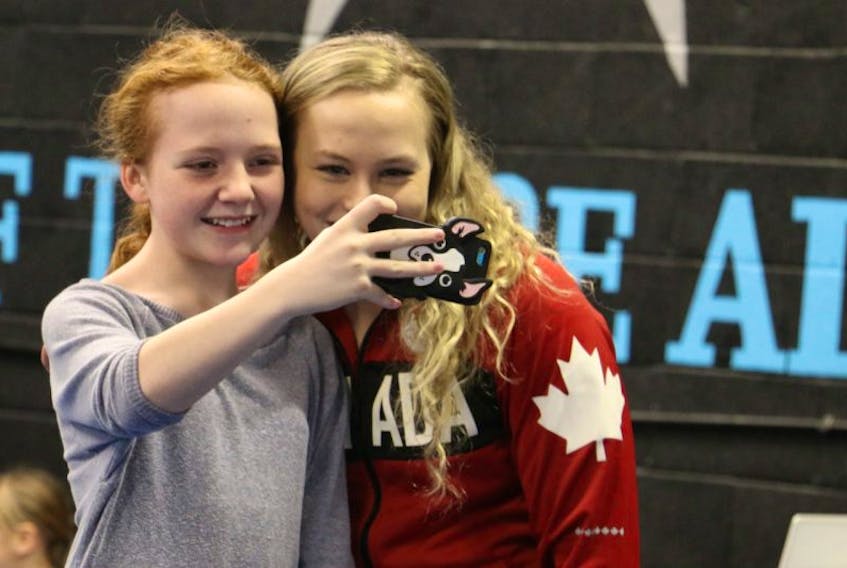 Whether it was taking selfies or parents snapping photos with cellphones, Olympian Ellie Black was likely the most photographed person in Windsor Dec. 10.