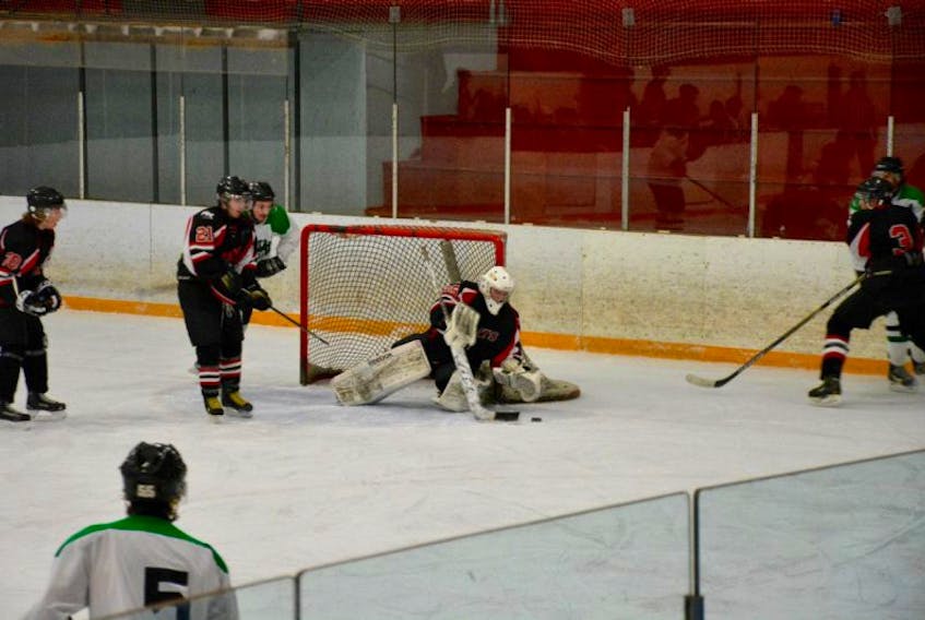 River Rats goaltender Carter McMullin stops the puck at the Hants Exhibition Arena.