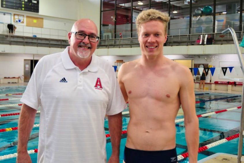 Acadia swim coach Gary MacDonald, left, with Guy Harrison-Murray, a swimmer who recently competed at the Rio ParaOlympics. Harrison-Murray will swim for Acadia this fall.