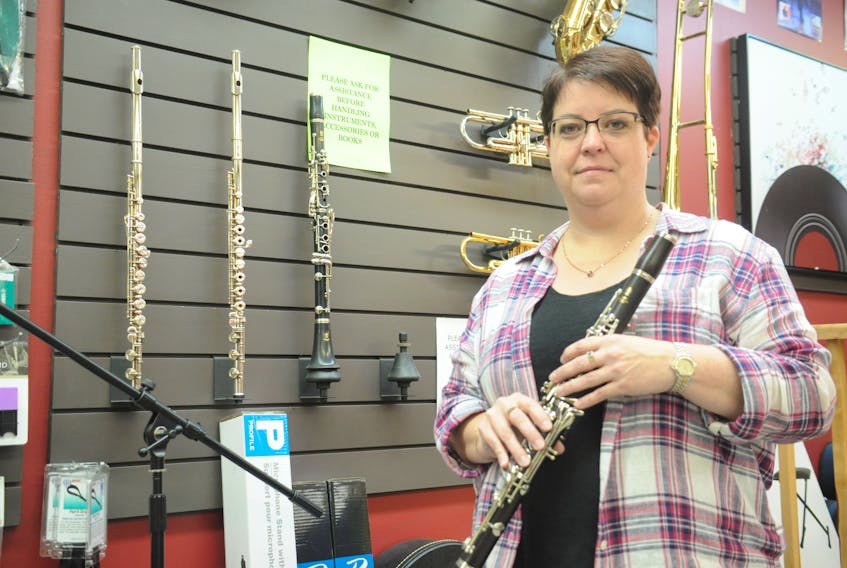 Karen Michael, the owner of Gary Bennett Music in Corner Brook and a trained clarinetist, is seen here holding her favoured instrument - the clarinet. STEPHEN ROBERTS PHOTO