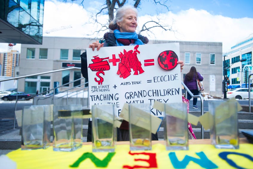 Kathrin Winkler, a member of Nova Scotia Voice of Women for Peace marks the Global Day of Action on Military Spending by holding a small rally outside the Halifax Central Library on April 11, 2019.