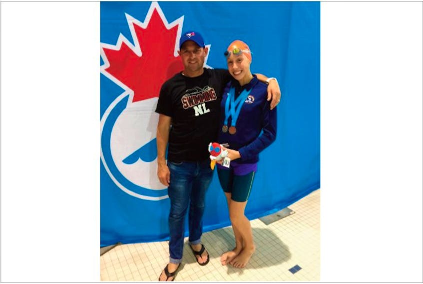 Kate Sullivan will have to pose for a new photo. The 14-year-old from Mount Pearl is shown with Newfoundland and Labrador swim coach Chris Roberts after winning a silver and a bronze medal in freestyle events at the national junior swimming championships in Toronto over the weekend. However, Sullivan has another medal, a gold she won today in the 5,000-metre open-water event at the championships.
