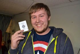 Tignish Chase the Ace grand prize winner Keaton Noye with the winning card he drew Friday, Nov. 27, 2015.