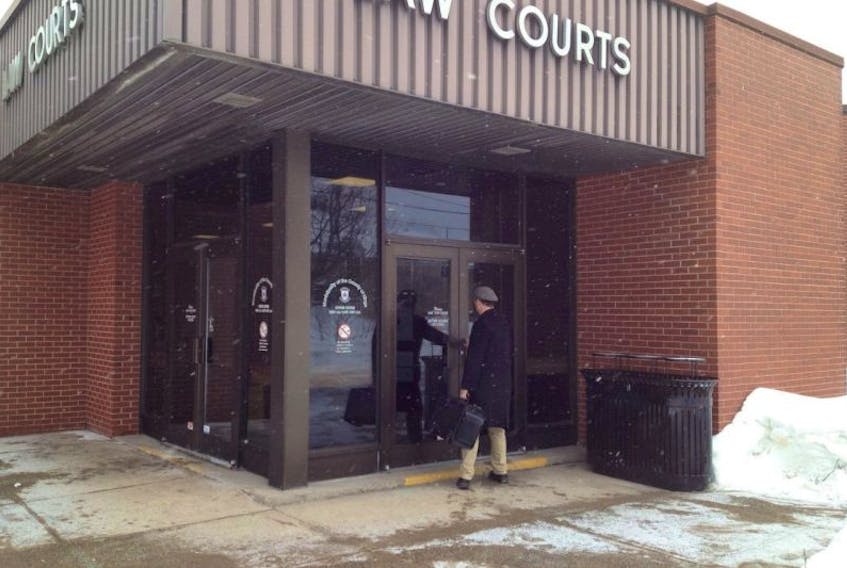 <p>Nova Scotia Legal Aid lawyer Ken Greer makes his way into Kentville court on Feb. 25. He’s representing the New Minas teenager charged with attempted murder following an August incident on Chester Avenue.</p>