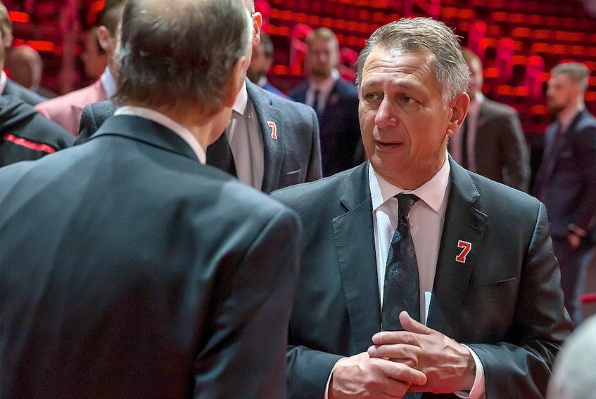 Detroit Red Wings GM Ken Holland talks to the Lindsay family during the public visitation of Ted Lindsay at Little Caesars Arena on March 8, 2019 in Detroit. 
