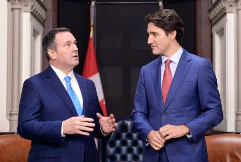 Alberta Premier Jason Kenney meets with Prime Minister Justin Trudeau on Parliament Hill in Ottawa on Dec. 10, 2019. At some point, Canada will debate health versus economy as social distancing restrictions and COVID-19 strangle activity, says columnist.