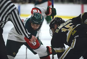 Charlottetown Bulk Carriers Knights forward Jesse Blanchard, right, and Kensington Monaghan Farms Wild forward Patrick Shea prepare for a faceoff during Game 1 of the P.E.I. major under-18 hockey final Saturday in Charlottetown.
