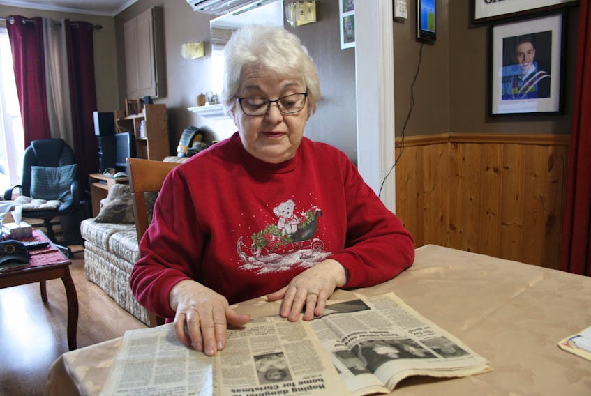 Eileen Rose looks back over some newspaper articles written about her grandniece, who was diagnosed with cancer in 2003. It spurred her to get involved with fundraising for the Canadian Cancer Society. PAUL HERRIDGE/THE SOUTHERN GAZETTE