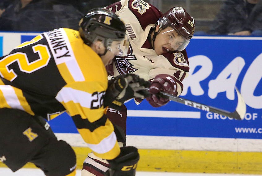 Petes’ Nick Robertson gets a shot off past Kingston Frontenacs defenceman Jakob Brahaney. In the annual OHL coaches poll,  Robertson cracked the top three in six categories in the Eastern Conference.  Postmedia Network