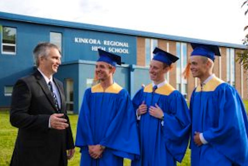 ['Kinkora Regional High School principal Donald Mulligan, left, jokes with valedictorian Darien MacDonald, student council president Zachary Muttart and Governor General Bronze Medal winner Blaise Roberts prior to graduation ceremonies Tuesday night. The 50th annual commencement exercises at KRHS saw 45 students walk across the stage to receive high school diplomas. In addition to receiving the Governor General’s Award for the highest average in the graduating class, Roberts was also named Student of the Year and received a full scholarship to the University of New Brunswick. ']
