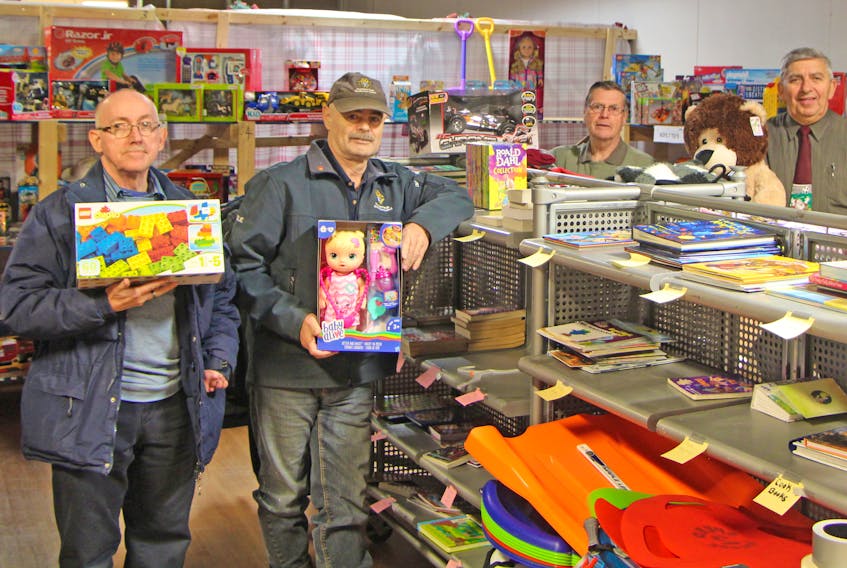 Volunteers with the Monsignor Hugh MacPherson Council of the Knights of Columbus toy drive delivered their final packages at 9 p.m. on Christmas Eve. File