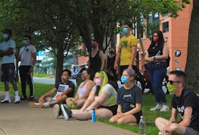 Halifax residents gather by the Public Gardens on a sweltering Saturday afternoon to rally for justice and human rights for the people of Hong Kong.