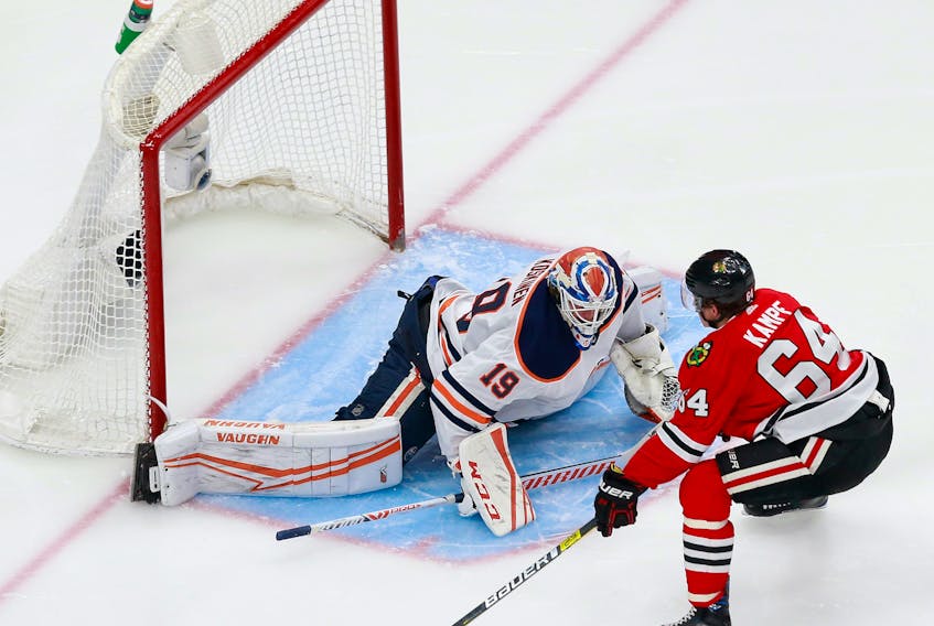 Mikko Koskinen #19 of the Edmonton Oilers stops a shot from David Kampf #64 of the Chicago Blackhawks during the second period in Game 4 of the Western Conference Qualification Round on August 07, 2020. 
