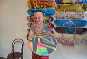 iGot Skate owner Inigo Cuartero with one of many skateboards he has for sale in his brand-new shop in Kentville. - Kirk Starratt
