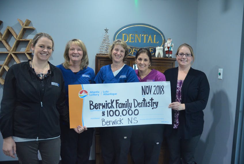 Amanda Steadman, Mary Ellen Lonergan, Karen Alcoe-Guest, Marie Roland and Kendra Balcom are among the members of a lottery pool at Berwick Family Dentistry sharing a $100,000 prize.
