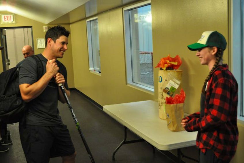 Caelyn Parker of South Berwick had a chance to hand deliver one of her unique Smoke Head creations to NHL star Sidney Crosby Aug. 10.