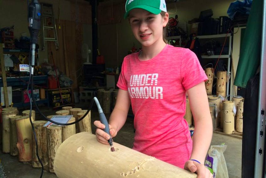 Caelyn Parker, 12, formed Caelyn’s Creations to sell the Smoke Heads bonfire accessories she made out of a tree that fell on her family’s car.