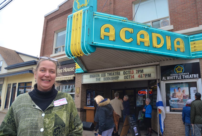 Al Whittle Theatre manager Mary Harwell had the honour of unveiling plaques officially designating the Acadia Cinema building a municipal and provincial heritage property. - Kirk Starratt