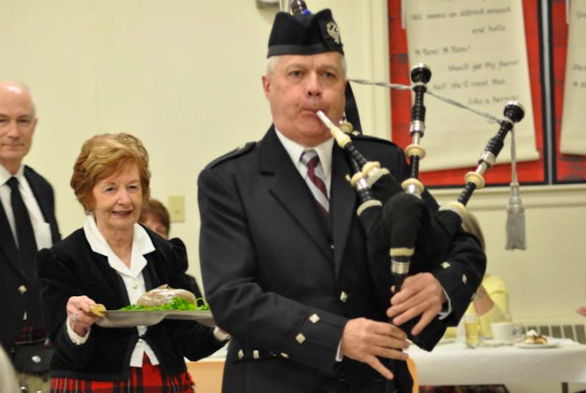 Piper Sandy MacMillan, haggis bearer June Jain and Rob Raeside, who recited the Address to the Haggis, were among a sold out crowd at the 42nd annual Port Williams Burns Night celebration.