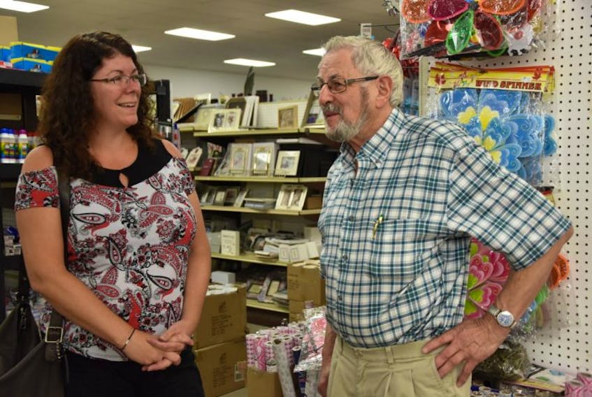 Natalie Jay from Tantallon mingles with Harley Moody in Bargain Harley’s. Jay used to make regular trips to the Berwick-based store from Pictou, and her kids always get excited to see “Bargain Harley.”