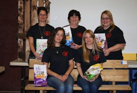 The Redemption Alley Pet Food Bank committee include, from left, in front, Erika Gates and Kristin Savary. In back are Carol Coleman, Delcia Filippone, and founder Kim DeEll. The sixth member, Julia Coleman, was missing when the photo was taken. The group wants to raise funds toward a pet food bank for the benefit of pet owners who have temporarily fallen on hard times, to help them keep their pets.