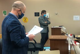 Kurt Churchill's lawyer, Robby Ash (foreground), and prosecutor Mike Murray proceeded with Churchill's trial Monday, even though Churchill was not present in the courtroom. The 43-year-old was convicted of threatening a police officer in March 2019.