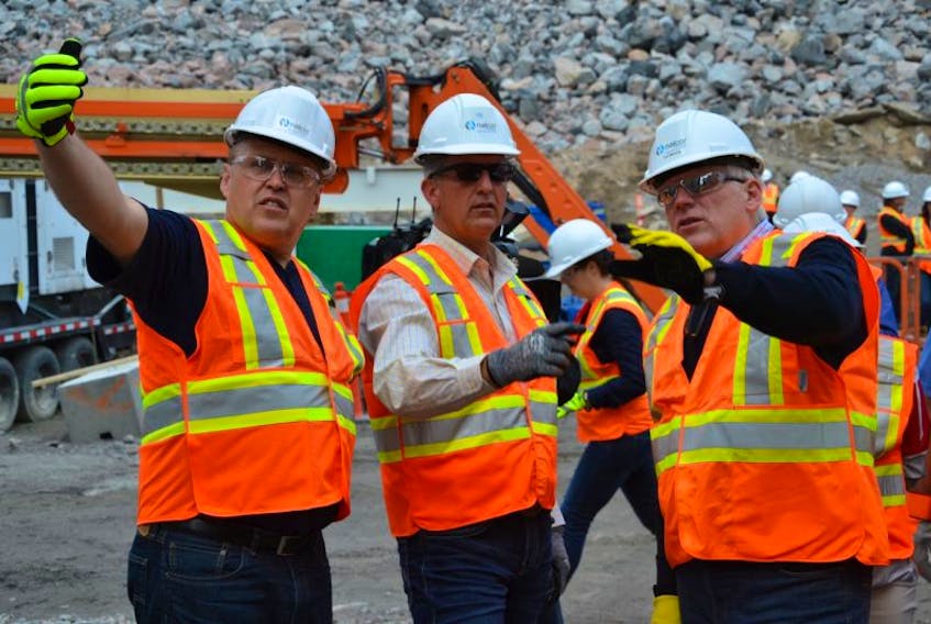 Nalcor president and CEO Ed Martin (right) shows Yukon Premier Darrell Pasloski (left) and NL Premier Paul Davis the spillway construction at Muskrat Falls.