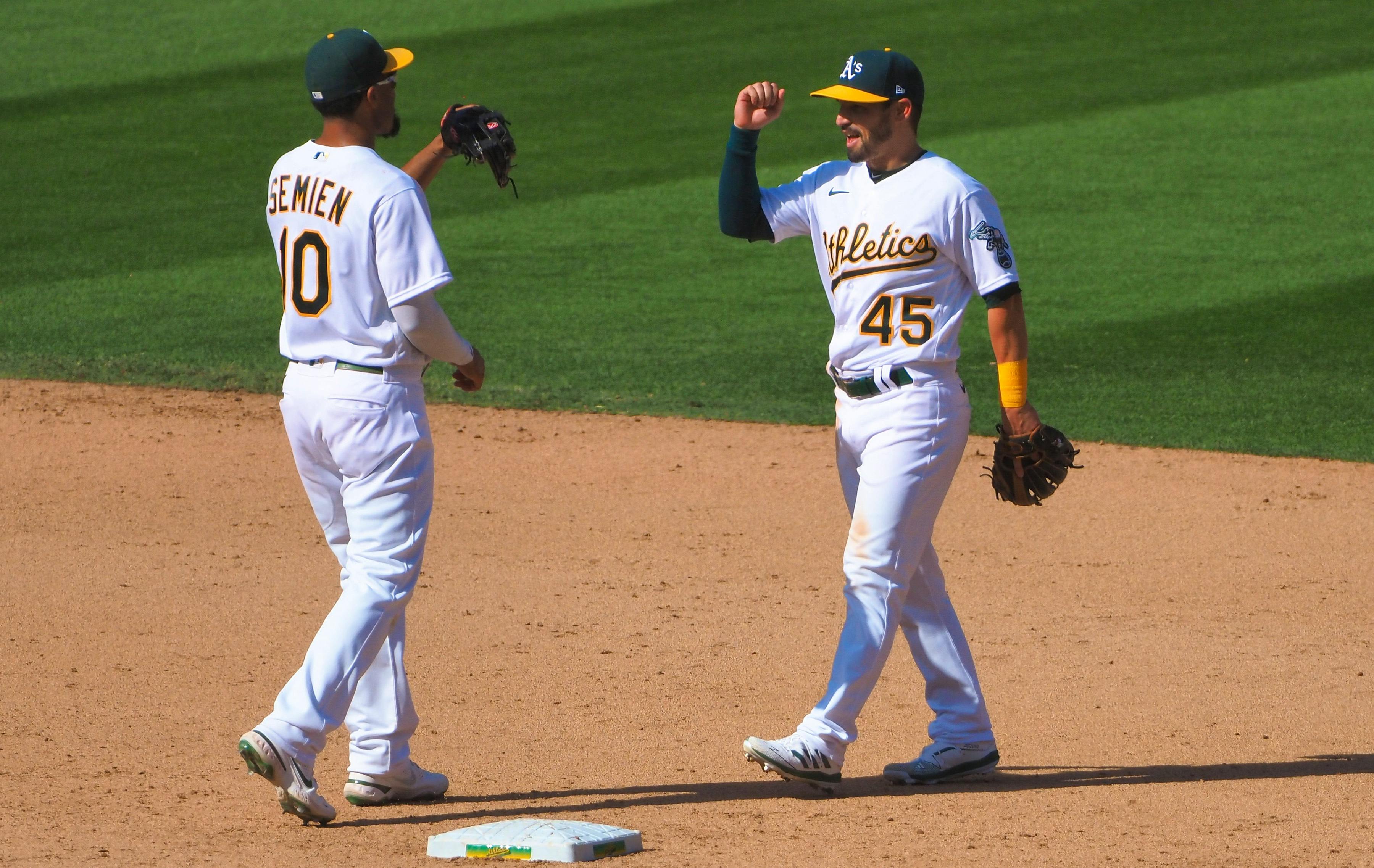 Lamb, Canha guide playoff-bound A's past Mariners
