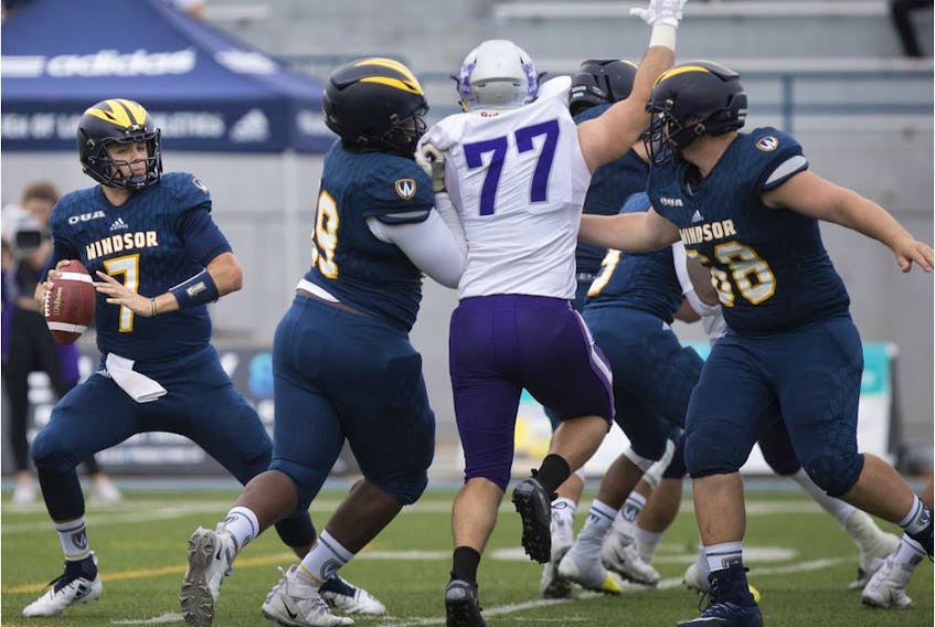 Windsor Lancers quarterback Sam Girard scrambles out of the pocket during Saturday's OUA football game against the Western Mustangs at Alumni Field.