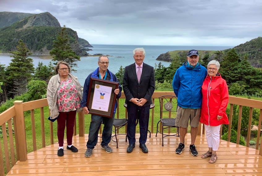 It was a special moment for all when Ralph Joyce (second from left) of Lark Harbour was presented with a Newfoundland and Labrador Bravery Award. Also pictured are his wife, Linda Robinson (left), Humber-Bay of Islands MHA Eddie Joyce, John Parsons, the man he rescued, and Sharon Parsons. 