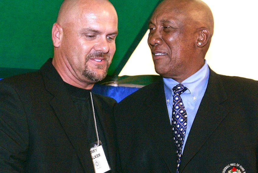 Larry Walker receives congratulations from Fergie Jenkins upon his induction into the Canadian Baseball Hall of Fame. 
