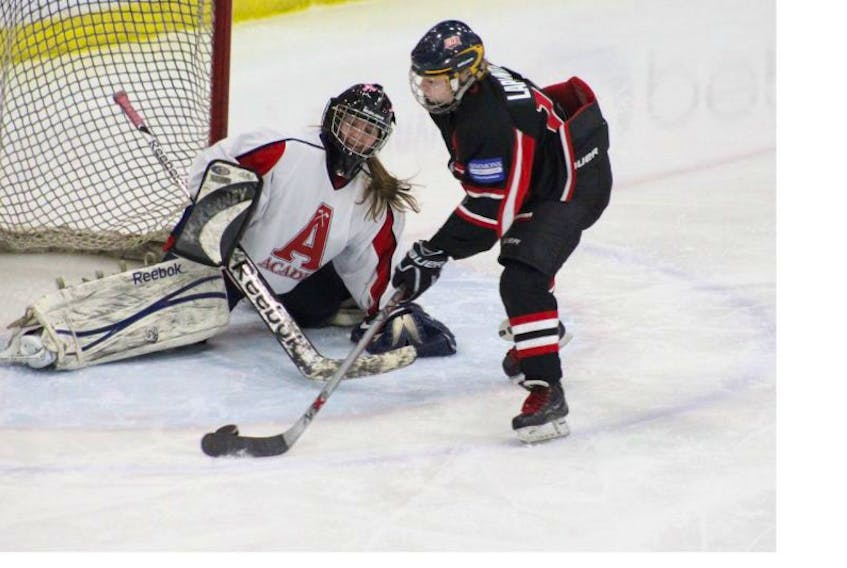 Acadia goalie Maria Gaudet stops UNB's Nathalie Laplante on a breakaway during round robin action at the East Coast Women's Hockey League championship tournament March 18-20 in Wolfville. Acadia claimed the bronze medal with a 3-1 win over Cape Breton March 20. Holland College edged UNB 3-2 in the championship game that followed. The host Axewomen lost 1-0 to Holland College, tied UNB 1-1 and blanked Cape Breton 4-0 in their round robin games. Gaudet, who is from Clare, had an outstanding tournament, playing all her team's games and recording a 0.89 goals against average with one shutout. She was named a second-team all-star. Alex Johnson of Port Willaims joined Gaudet on the second team, while Maddie MacKenzie and Chelsey Wilkins were first team all-stars.