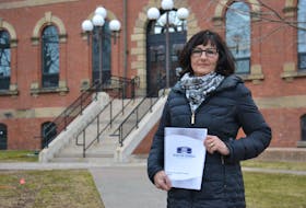 Auditor general Jane MacAdam hold a copy of her final report. The 2020 report, released in mid-March, includes an audit of the AccessAbility Services Program, IT security practices in government and Health P.E.I.'s laboratory services. 