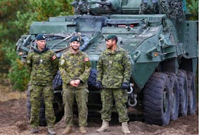 Canadian Army soldiers stand next to their LAV 6 armored personnel carrier during NATO enhanced Forward Presence battle group military exercise Silver Arrow in Adazi, Latvia October 5, 2019. REUTERS