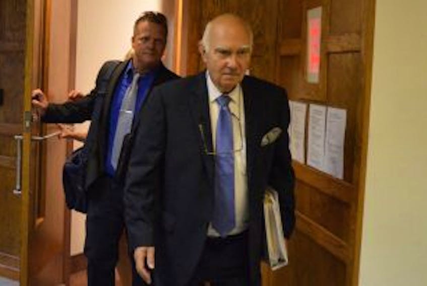['<p>Const. Wade Lavin, a suspended member of the Cape Breton Regional Police Service, follows his lawyer David Bright out of court Monday on the first day of his trial. Lavin is charged with impersonating a staff sergeant, forgery, uttering a forged document and conveying a false message.</p>']