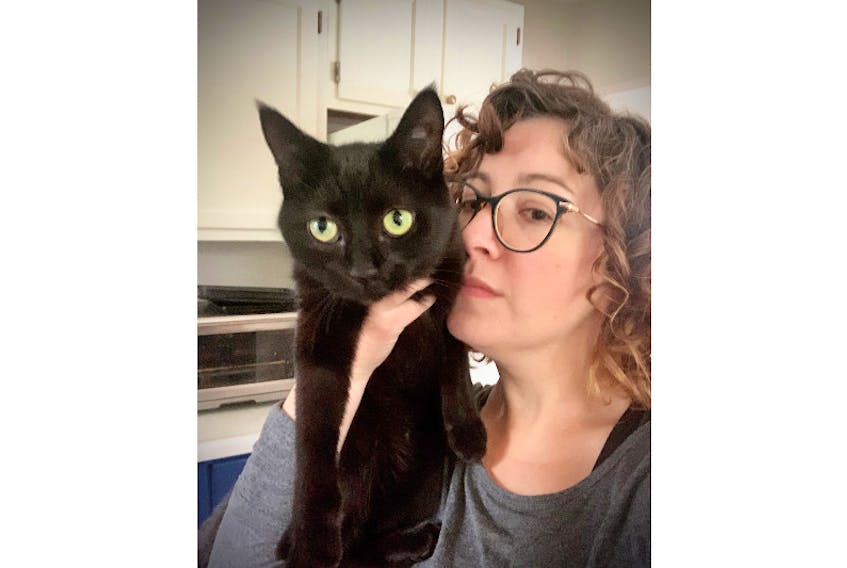 Animal rights advocate Jodi Lazare is pictured with June, one of her rescue cats.