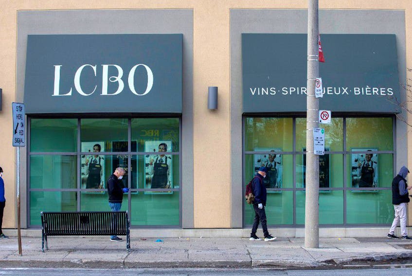 People wait outside of the LCBO (Liquor Control Board of Ontario) to purchase alcohol as the number of coronavirus disease (COVID-19) cases continue to grow in Toronto, Ontario, Canada April 9, 2020. 