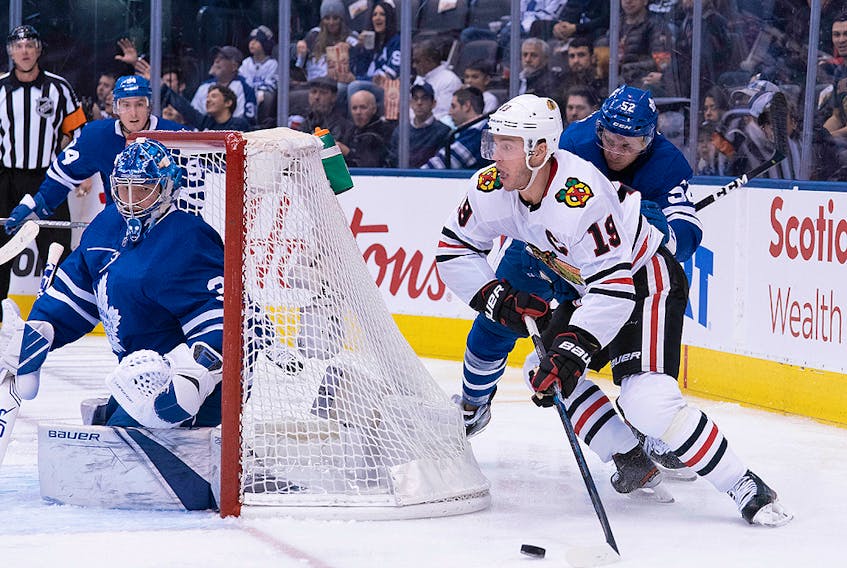 Chicago Blackhawks centre Jonathan Toews battles for a puck against Toronto Maple Leafs defenceman Martin Marincin behind Toronto goaltender Frederik Andersen during the second period at Scotiabank Arena in Toronto on Saturday, Jan. 18, 2020. 