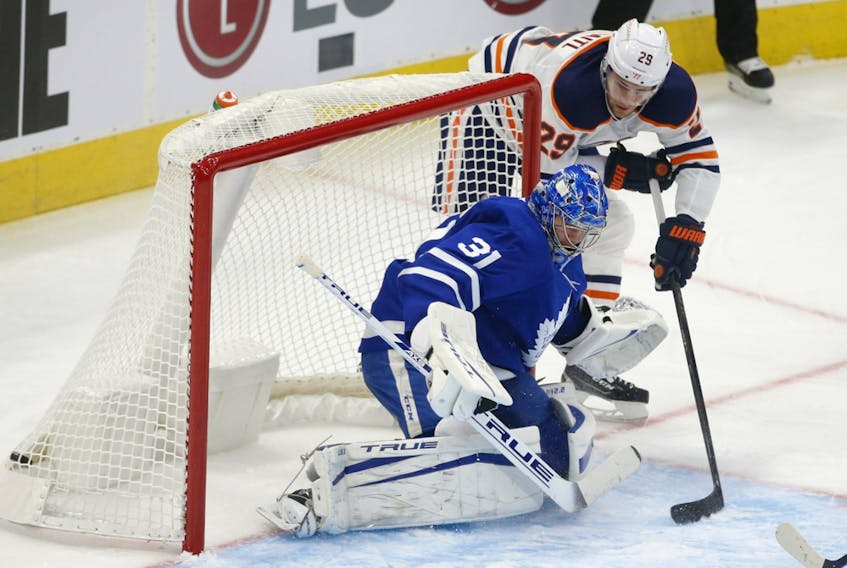 Edmonton Oilers centre Leon Draisaitl (29) scores shorthanded, beating Toronto Maple Leafs goalie Frederik Andersen (31) on a long reach during the second period in Toronto on Friday, Jan. 22, 2021.
