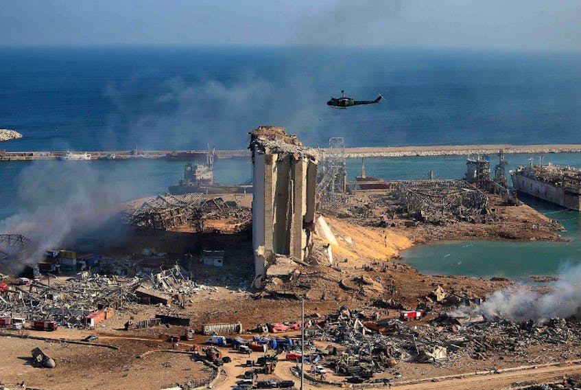 The damaged grain silos of Beirut’s harbour and its surroundings on Wednesday, one day after a powerful twin explosion tore through Lebanon's capital, resulting from the ignition of a huge depot of ammonium nitrate at the city’s main port. REUTERS
