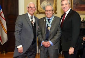 Dr. Falah Maroun (centre) receiving the Order of Newfoundland and Labrador in 2015 from then-lieutenant-governor Frank Fagan (left) and then-premier Dwight Ball. CONTRIBUTED
