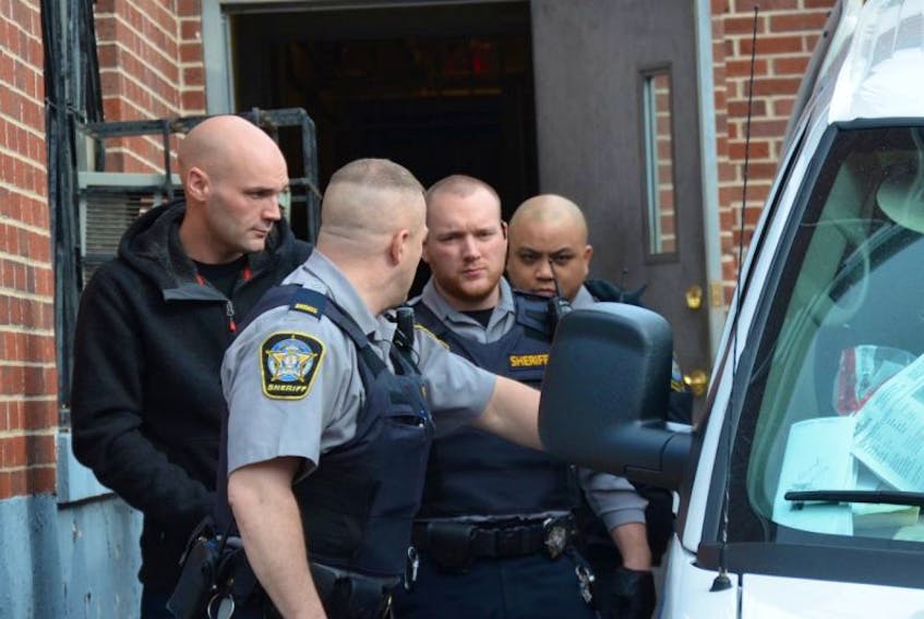 <p>Windsor resident Leif Spilchen, far left, was remanded into custody April 4 while he undergoes a mental health assessment. He is accused of robbing the Hantsport Valley Credit Union on March 30.</p>