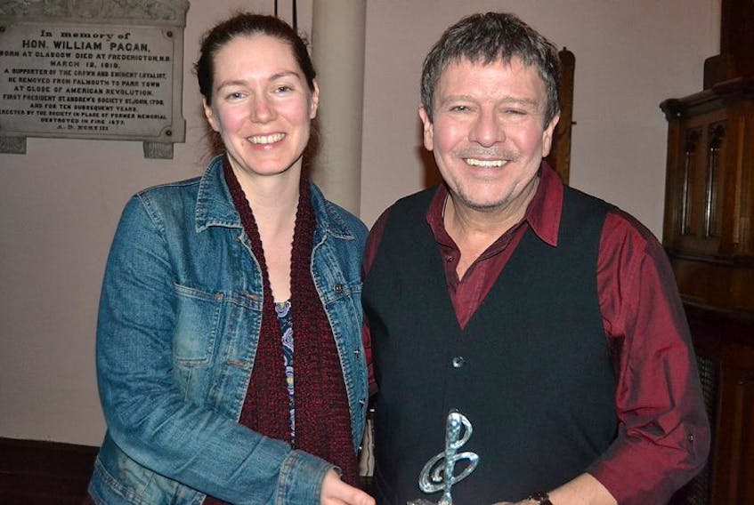 SALLY COLE/THE GUARDIAN
 Catherine MacLellan congratulates Lennie Gallant on winning folk recording of the year at the Folk Stage at the 2017 East Coast Music Awards in Saint John, N.B. on Saturday. MacLellan, who is also from P.E.I. emceed the showcase.