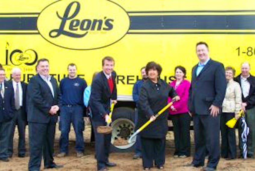 ["Leon's Kentville staff and owners  John Coady (front, left) and Colin Lewis (front, right), along with Kings County Warden Diana Brothers and Kings-Hants M.P. Scott Brison,  celebrate the groundbreaking for the store's new location in Coldbrook Village Park. "]