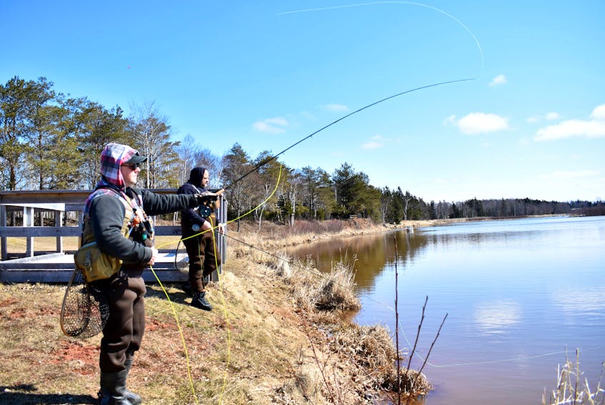 A couple of P.E.I. anglers cast barbless fly hooks into Scales Pond in this file photo.