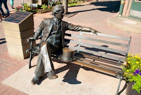A statue of Canada's first prime minister, John A. Macdonald, sits at the entrance to the part of Richmond Street known as Victoria Row. 