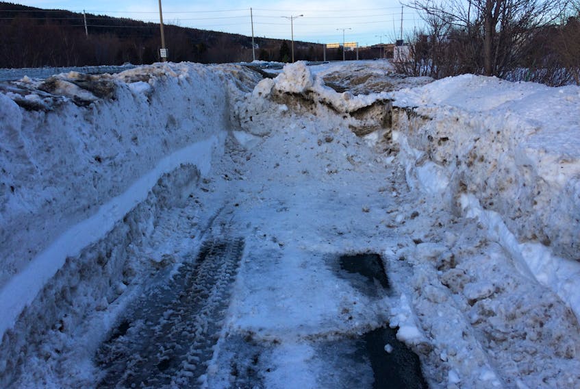 St. John's after Snowmageddon. There's a sidewalk under here somewhere. — Telegram file photo