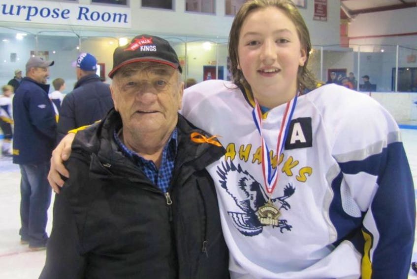 Lewisporte Seahawks assistant captain Travis Fifield with Albert Little, father of the late Dean Little.