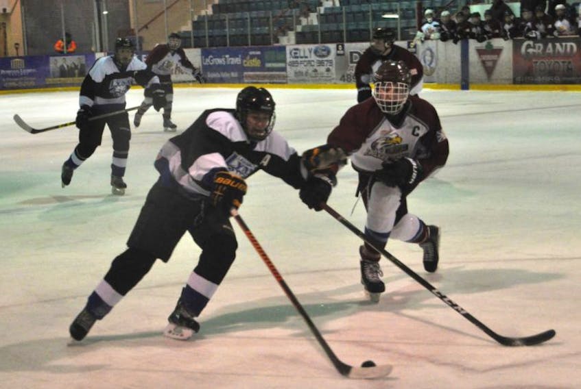 Marcus Kinden of the Lewisporte Lynx tried to beat an Exploit’s Valley High defender in the first round robin game of the annual Donnini’s High School Hockey Tournament in Grand Falls-Windsor over the weekend. The game ended in a 2-2 tie.